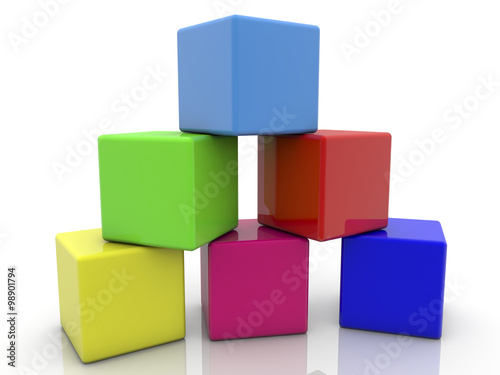 Toy cubes pyramid in various colors on white