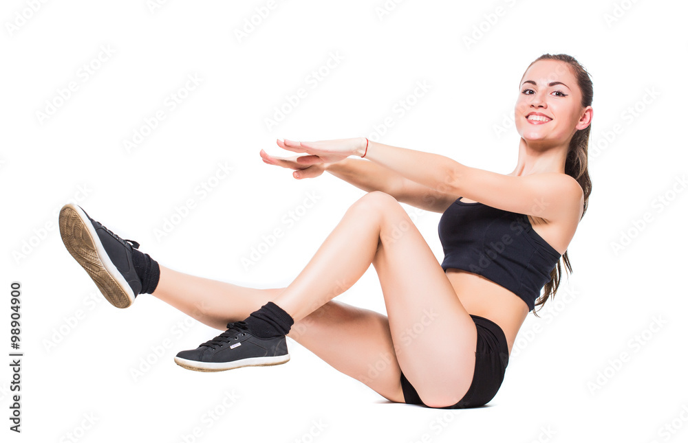 Attractive fit woman exercising in studio with copyspace. Image of healthy young female athlete doing fitness workout against grey background. Attractive fit woman exercising in studio with copyspace. Image of healthy young female athlete doing fitness workout against grey background.