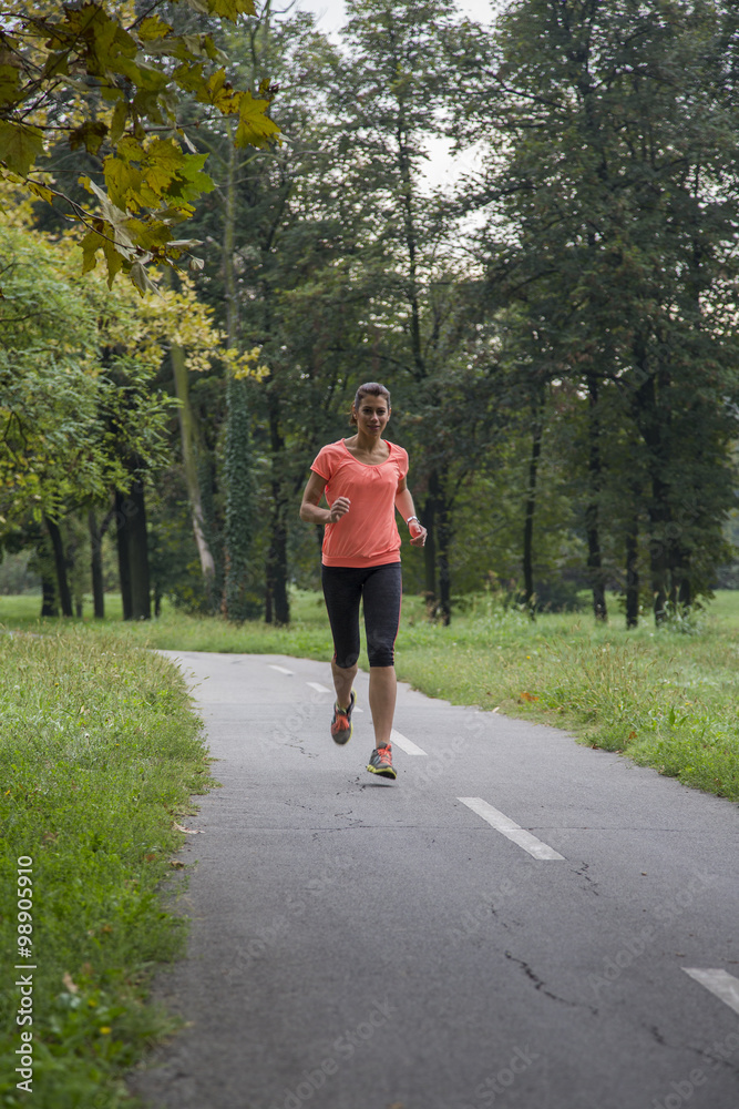 Young woman running outdoors