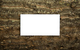 Blank business card on a wooden surfaces