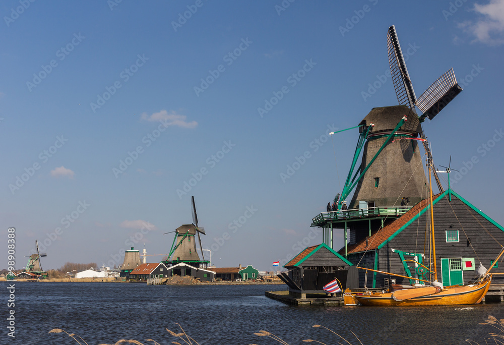 Traditional Dutch old wooden windmill in Zaanse Schans