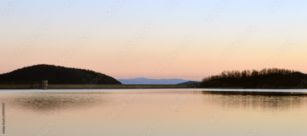 Artificial lake in sunset with reflection