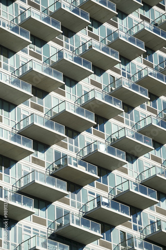 Abstract architectural background of glass balconies on modern building