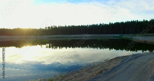 Aerial slow flight near the lake in 4K
