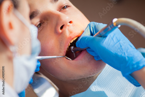Dentist treatment a patient s teeth in the dentist.