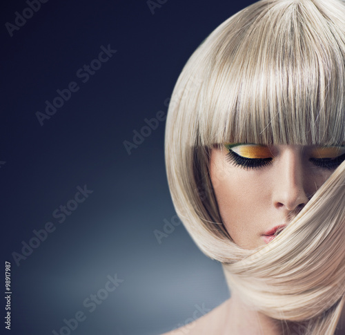 Fotobehang Portrait of a blond lady with trendy coiffure