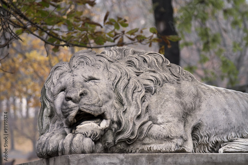 Lion statue on pedestal