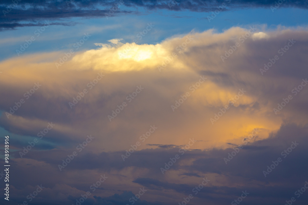 Fototapeta Light and orange sunset in the clouds over Bolivia