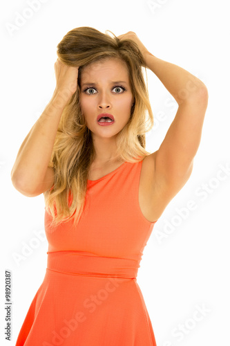 woman stand in red dress hands in hair mad © Poulsons Photography