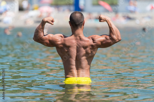 Biceps Pose In The Swimming Pool