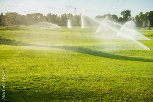 Green golf courses watered special devices photo