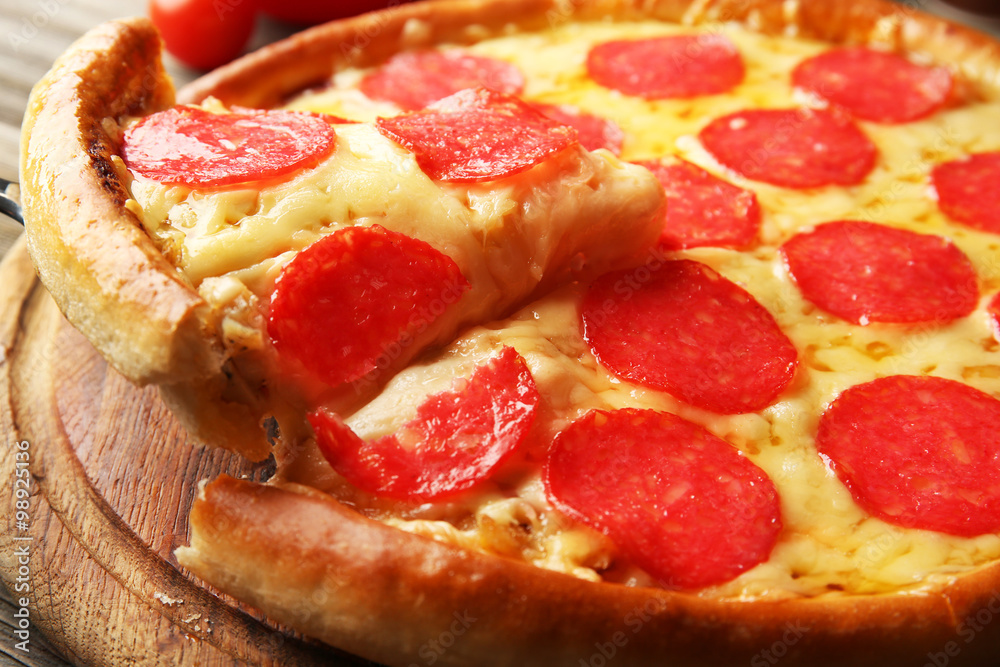 Hot tasty pizza with salami, close up Hot tasty pizza with salami, close up