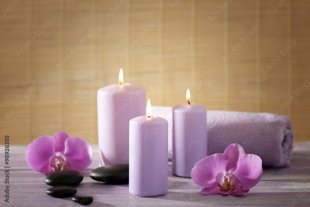 Spa set with flowers on wooden table