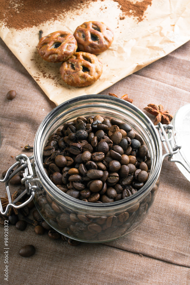 Fototapeta premium Closeup of a coffee beans in transparent jar