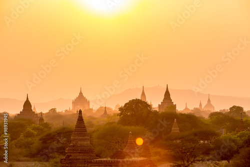 Sunset over pagoda temples with fog of Bagan in Myanmar.