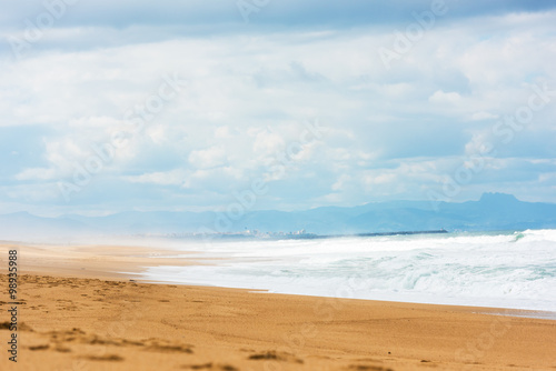 Fototapeta Naklejka Na Ścianę i Meble -  Long Sand Atlantic Beach with ocean waves