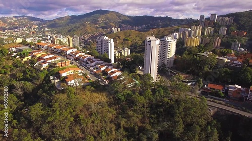 Aerial view of a residential district overflight on a capital city: Caracas city Valley.  Caracas is the capital, the center of the Greater Caracas Area.