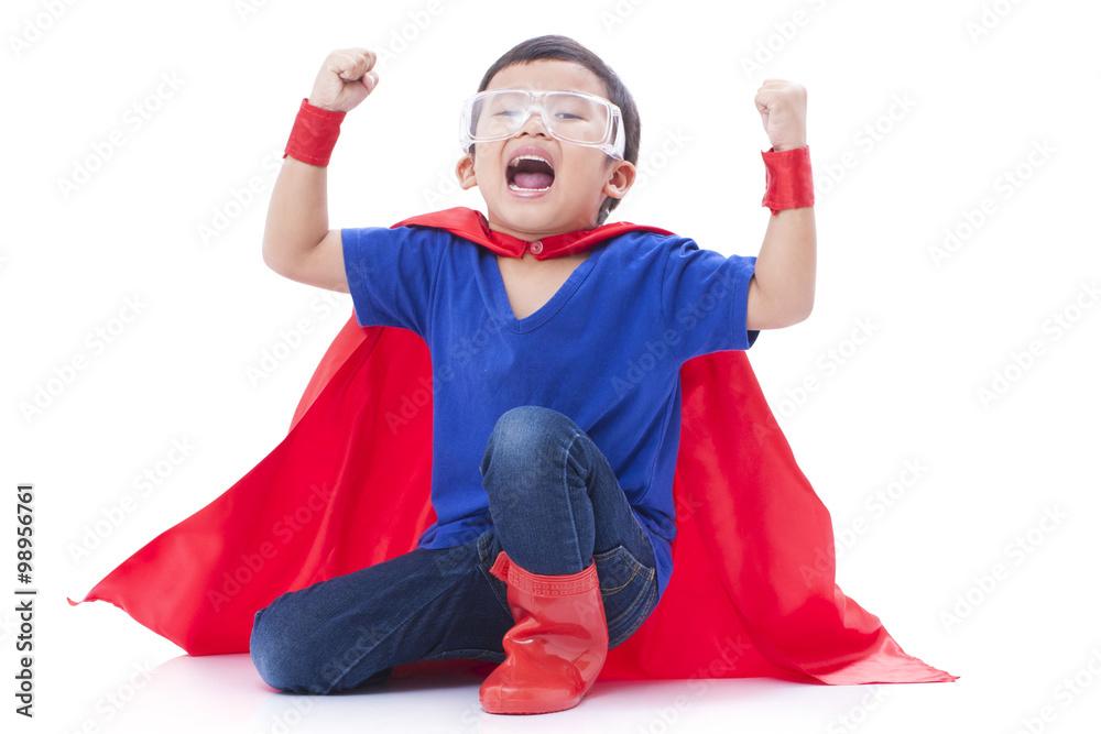 boy pretending to be a superhero on white background boy pretending to be a superhero on white background