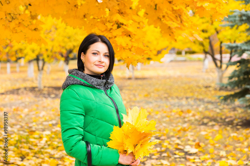 Attractive woman enjoying an autumn park
