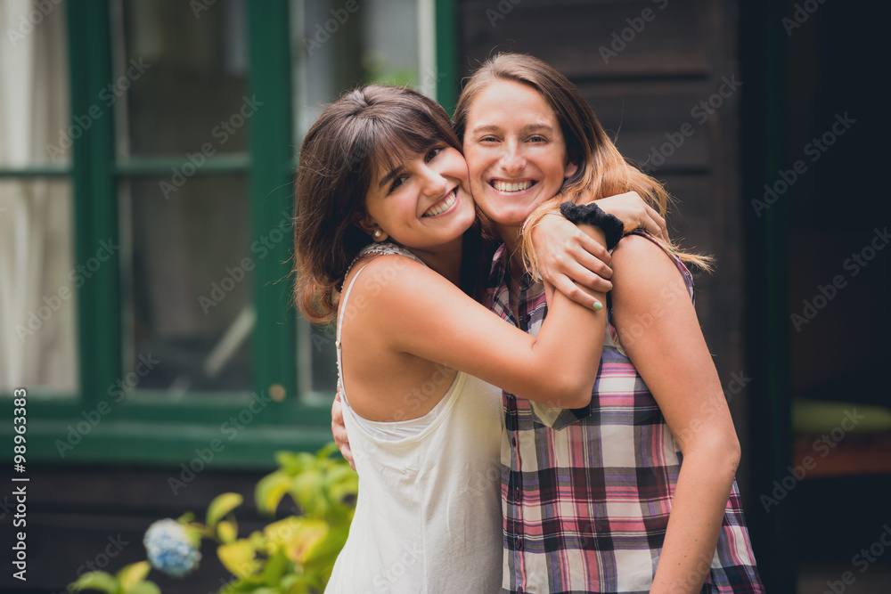Two sisters hugging each other with love. Two sisters hugging each other with love.