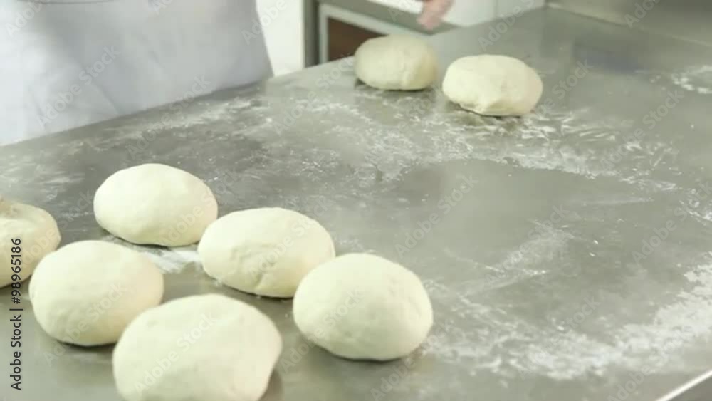 Woman preparing pizza dought Woman preparing pizza dought