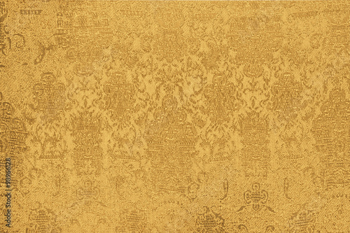 shiny gold fabric with a pattern closeup