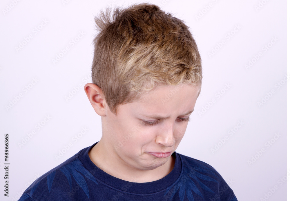Portrait of Confused Boy Isolated on the White Background Portrait of Confused Boy Isolated on the White Background