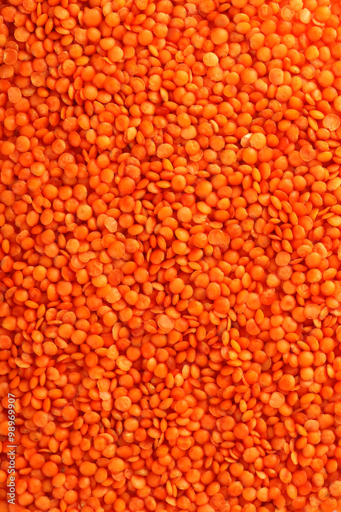 Red lentils background, close up Red lentils background, close up