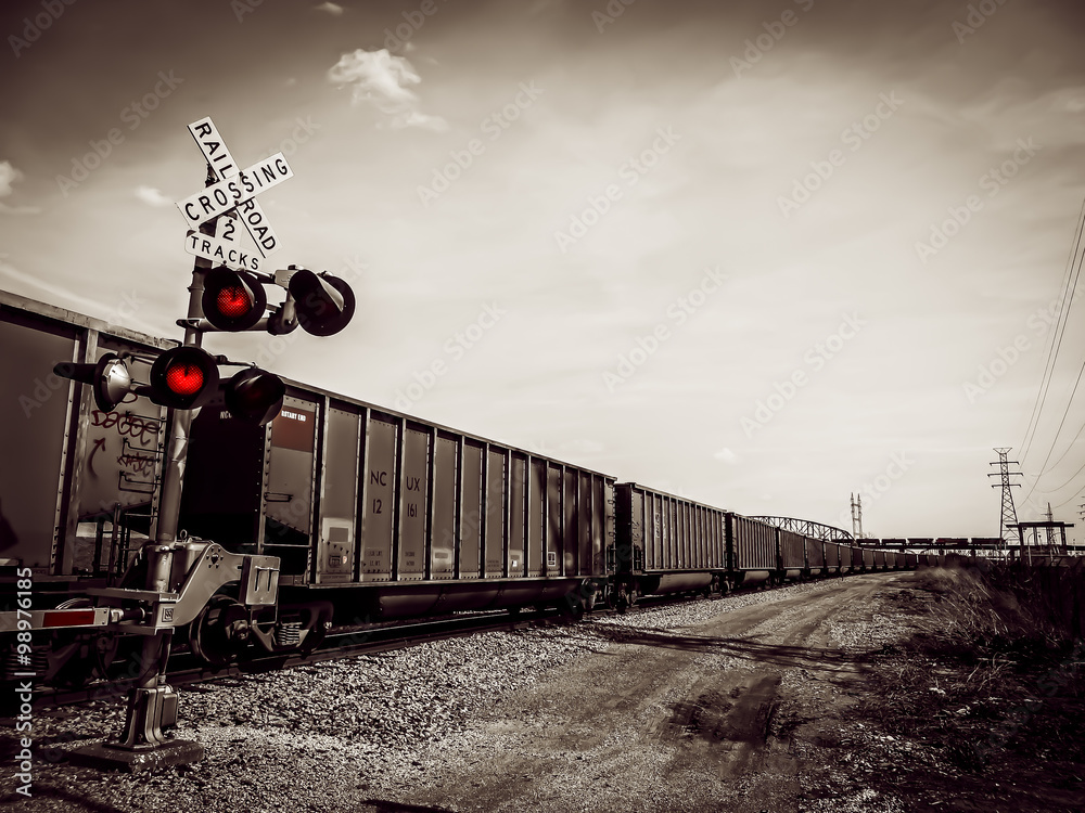 Obraz premium Railroad Crossing in Black and White - Cargo on Train - North Saint Louis, MO 