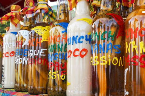 Assortment of ti-punch rhum bottles at Caribbean market