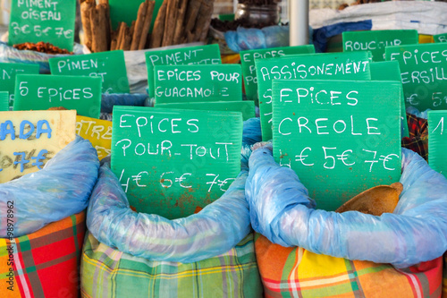 Quadro em tela Assortment choice of spices, baskets on Caribbean market stall in Guadeloupe