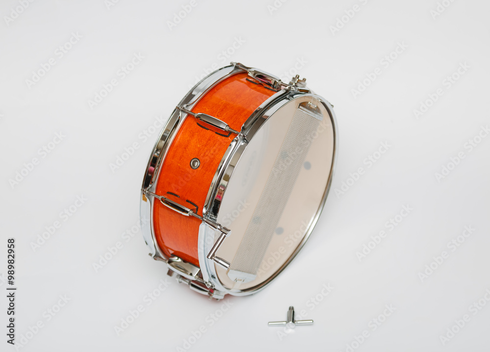 Great amazing closeup view of wooden mahogany color snare drum isolated on light grey background