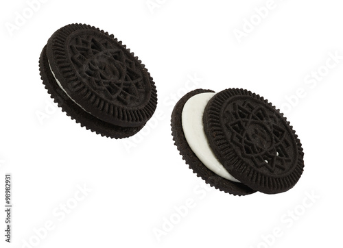 Close up isolated black cookies like oreo against hite background, computer ggenerated image in high definition