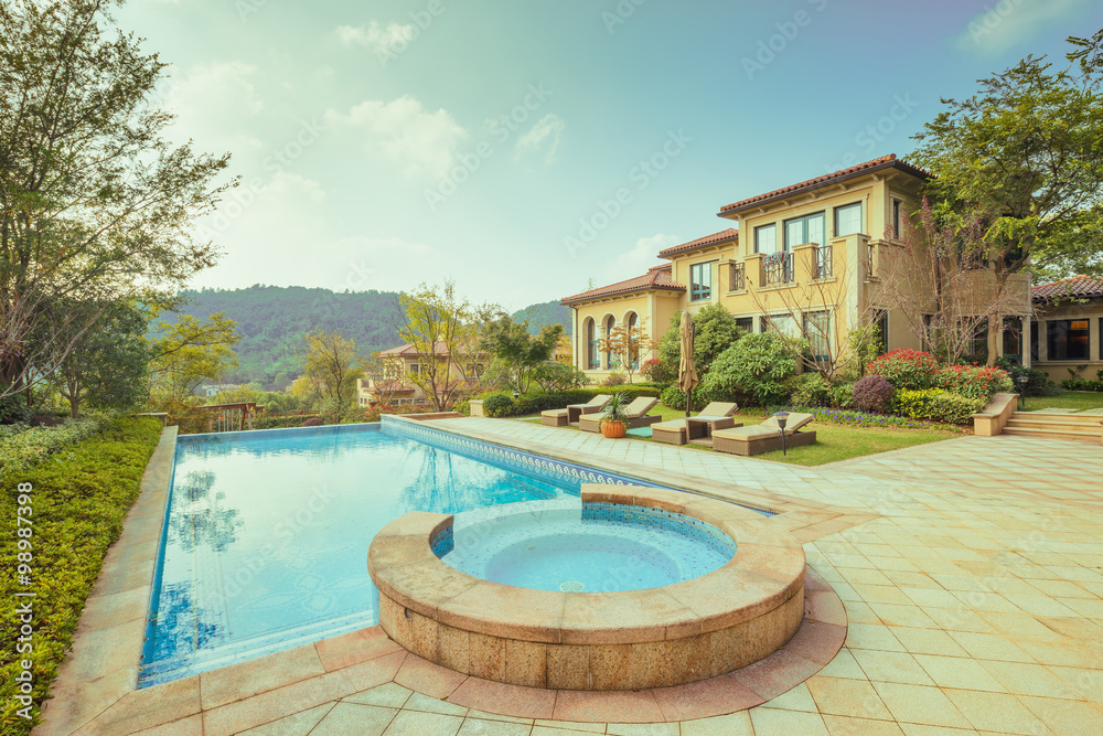 clean pond front of modern building in sunny sky