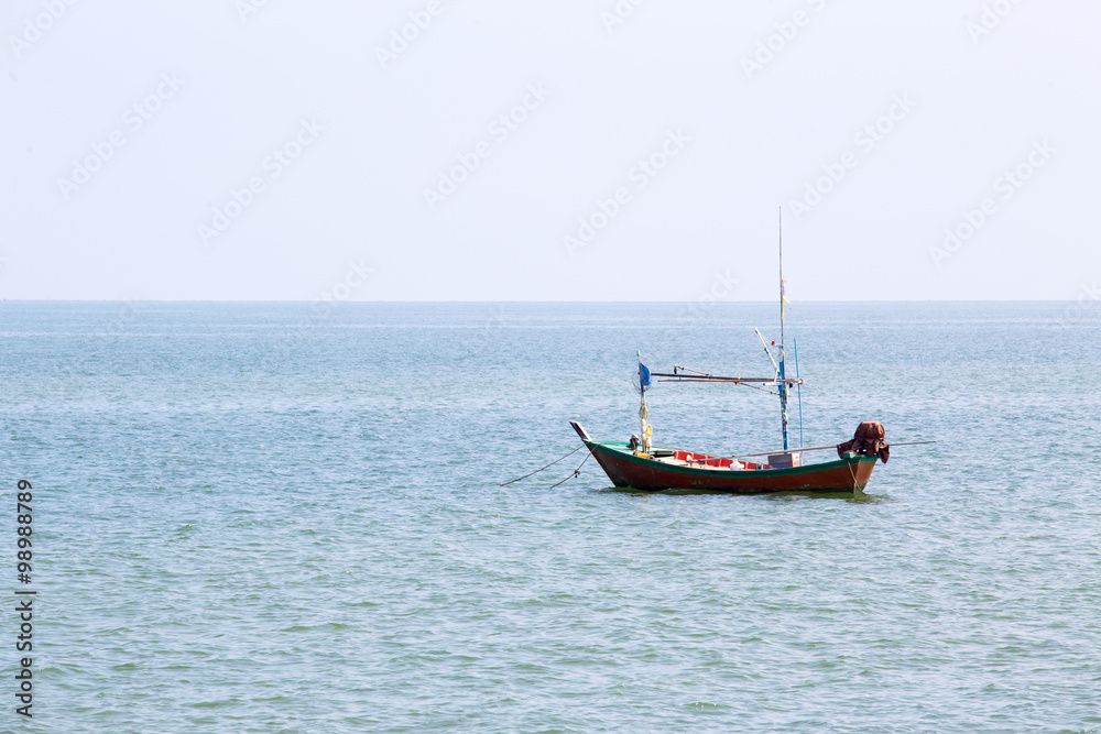 alone local fishery boat floating at sea