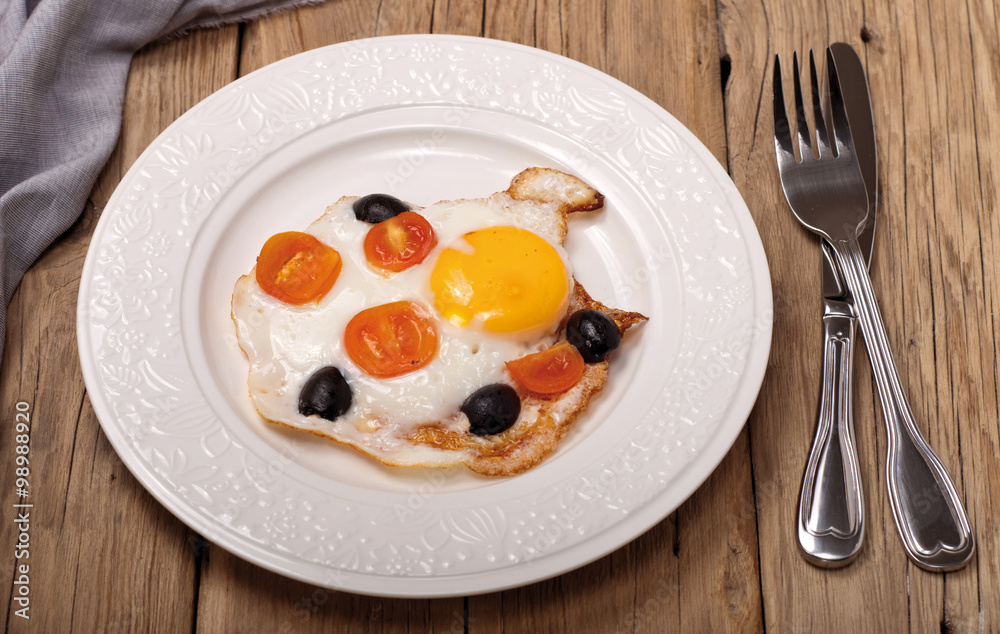 fried eggs with cherry tomatoes and olives fried eggs with cherry tomatoes and olives