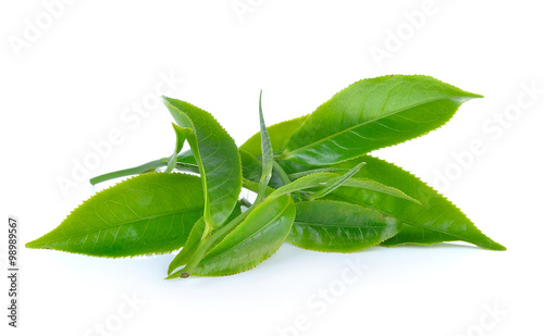 Green tea leaves on white background