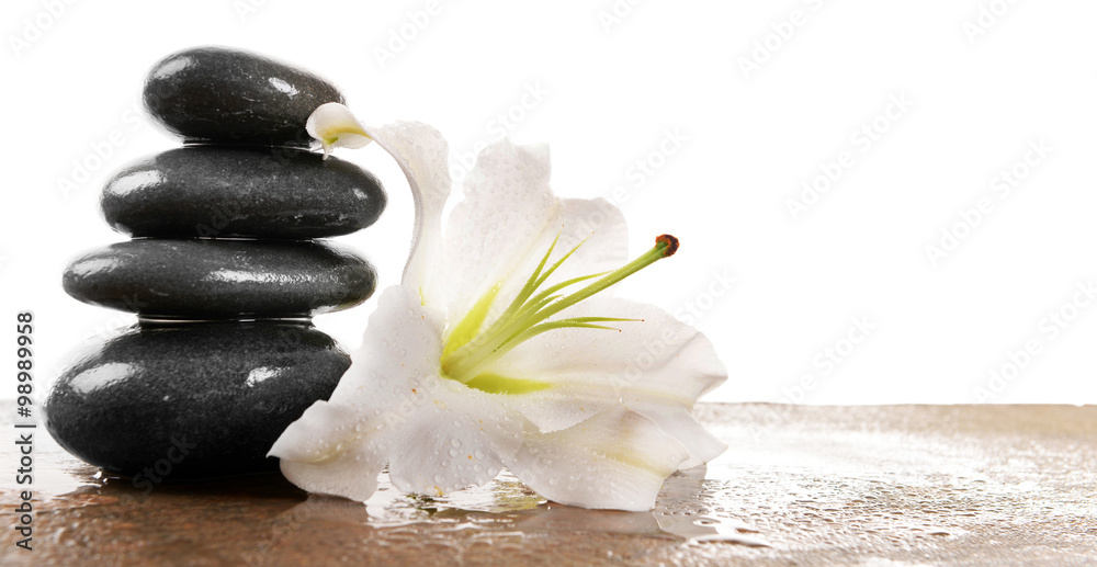Fototapeta premium Spa stones with lily, isolated on white