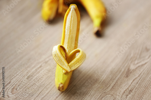 Heart made of banana on wooden background photo