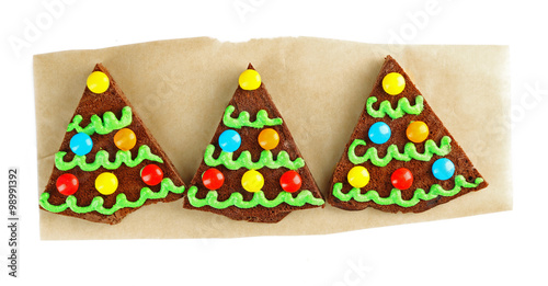 Delicious colorful Christmas cookie with paper, isolated on white