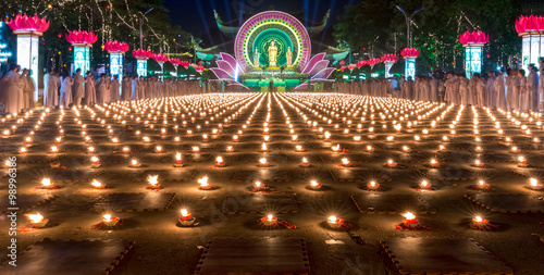 Beauty candles in night with thousands candles shining Amitabha Buddhist ceremony beautiful elegant, surrounded thousands Buddhist prayer honoring Buddha