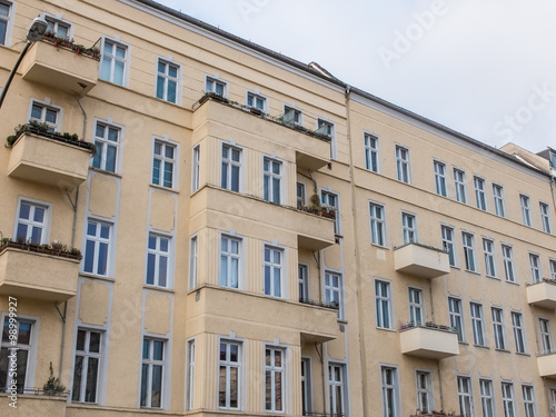 Yellow Apartment Building with Small Balconies