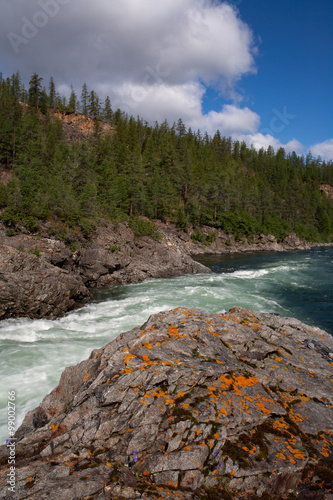 Rock obstacle on the mountain river. Omulevka River. Magadan Region. Russia. photo