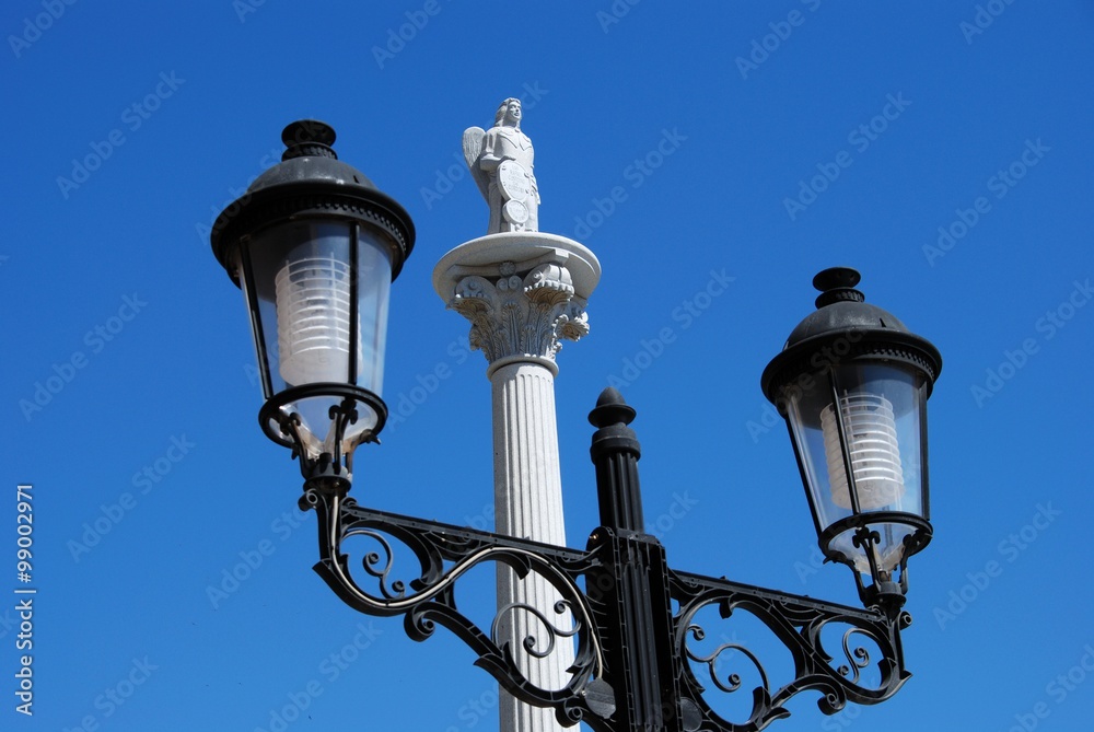 Spanish streetlight and monument, Fuengirola.