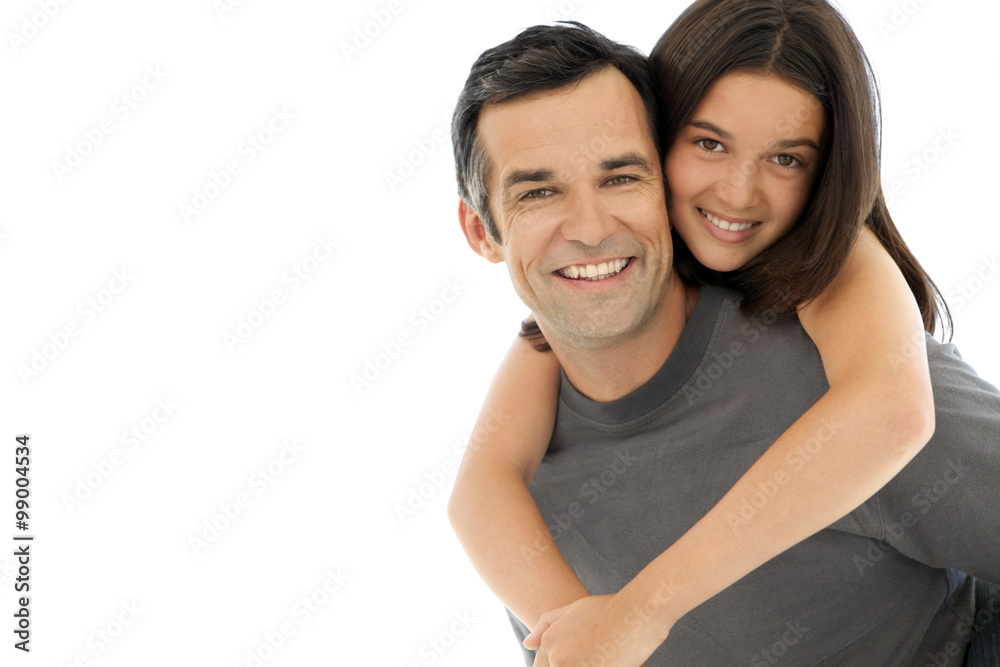 Piggyback ride with dad. Young girl having fun on her father's shoulders. 