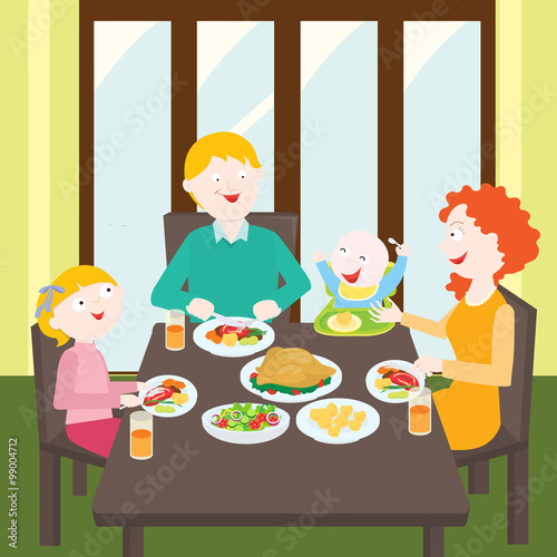 A family around a table eating dinner

