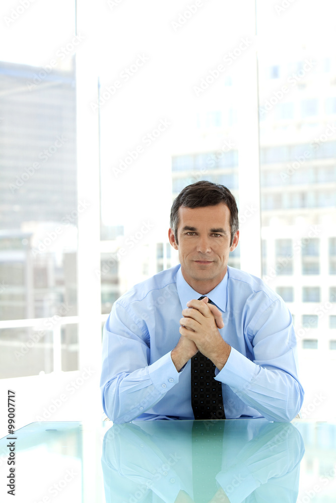 Portrait of a male business manager at workplace Portrait of a male business manager at workplace