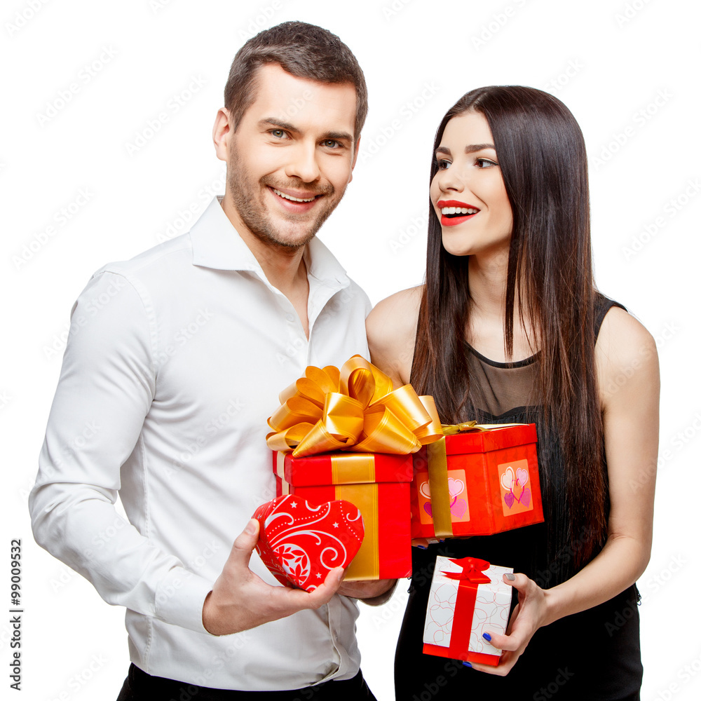 Young beautiful couple with present isolated on white Young beautiful couple with present isolated on white