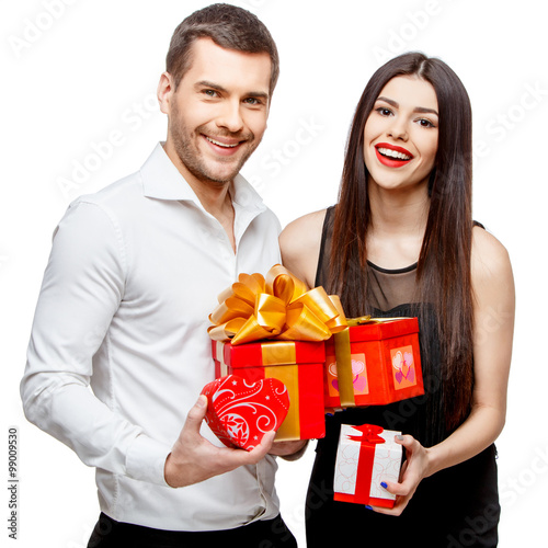Young beautiful couple with present isolated on white