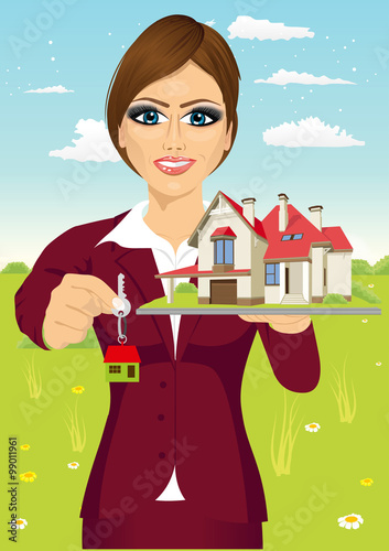 female real estate agent holding a model house